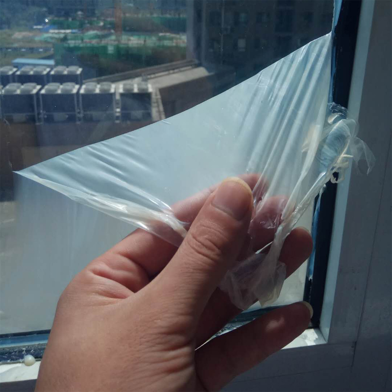 Water based peelable coating for glass building construction